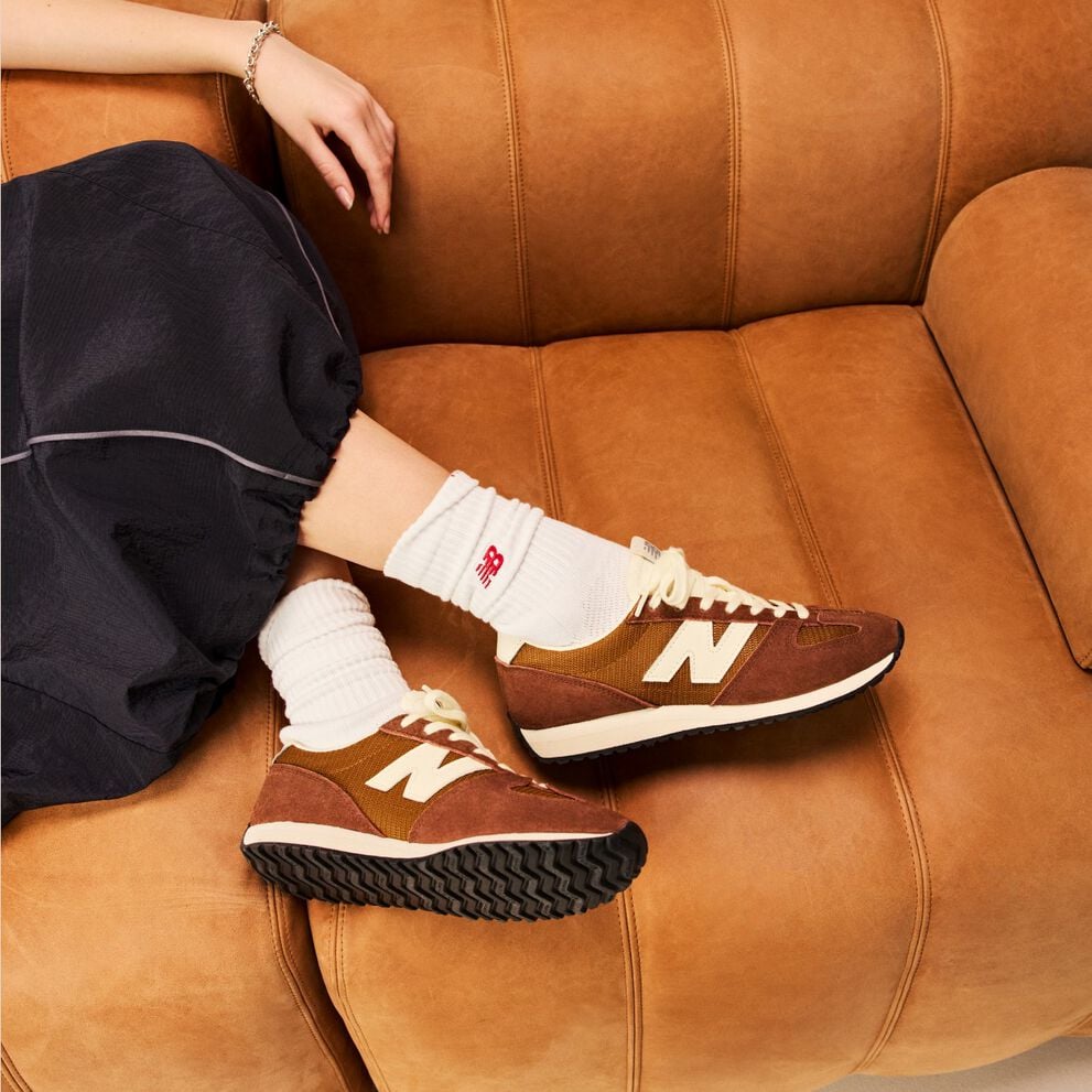 Person laying on a couch wearing the 471 