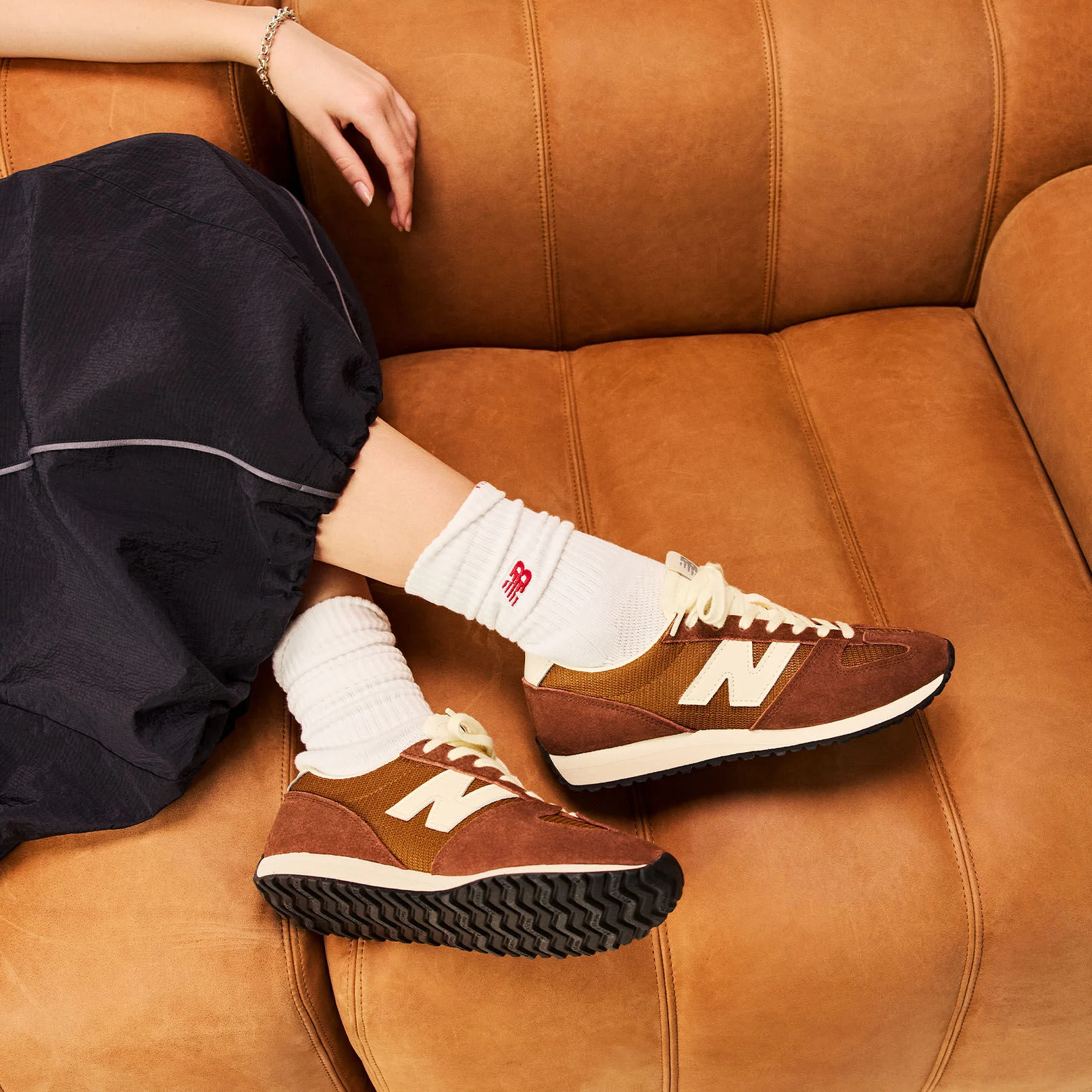 Person laying on a couch wearing the 471 