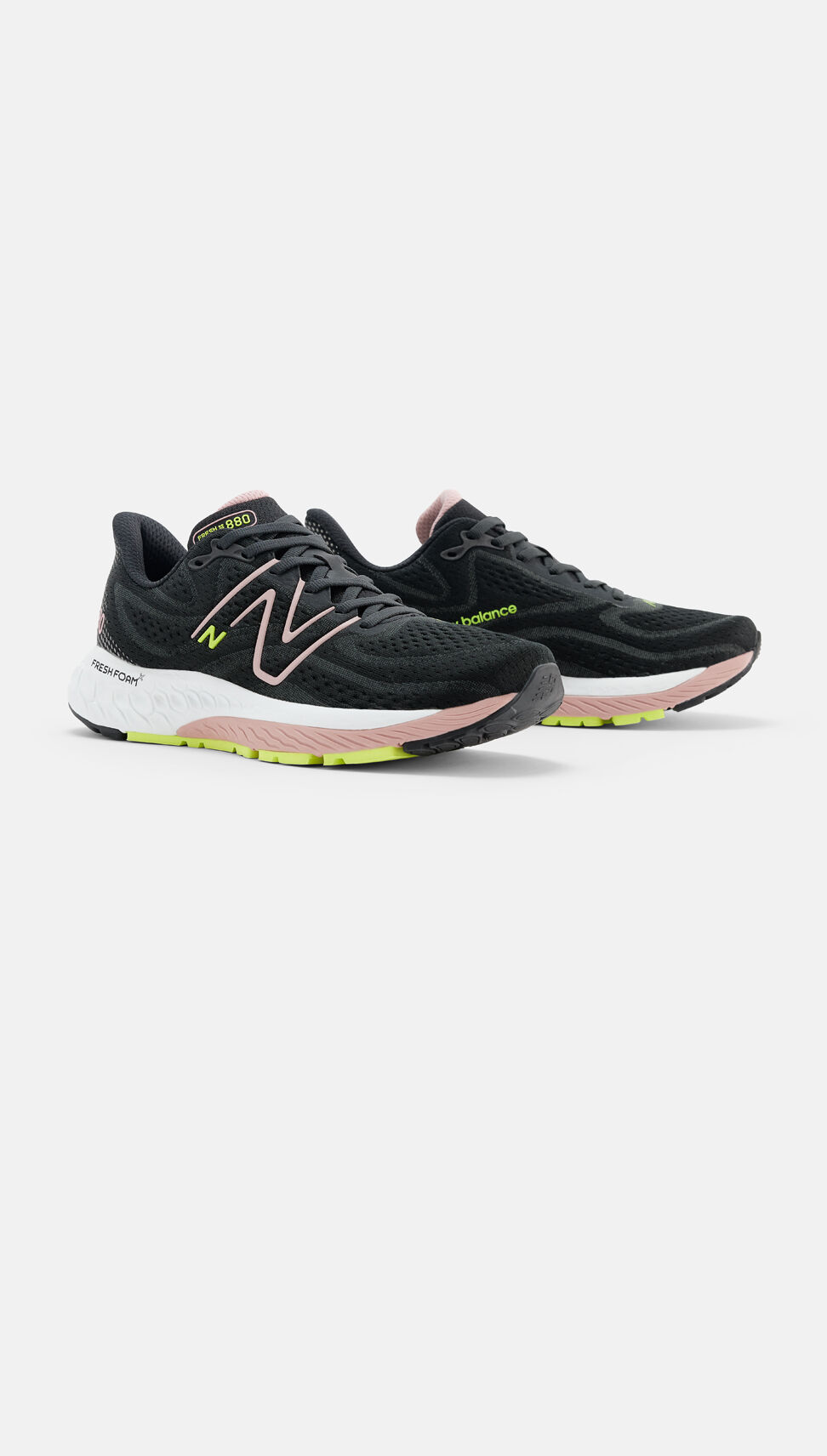Side view of a pair of black, pink, and green New Balance Fresh Foam X 880v13s. 