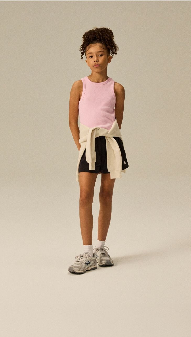 Girl wearing a pair of 204L shoes.