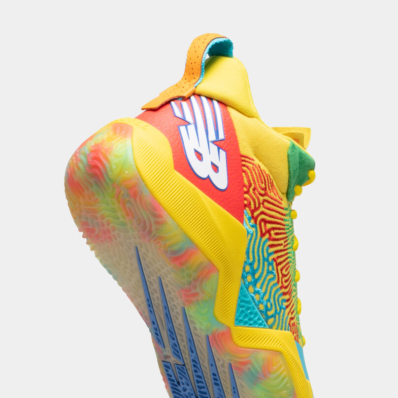 Floating yellow TWO WXY basketball shoe, with toe cropped, showing the backside of the heel on a light grey background