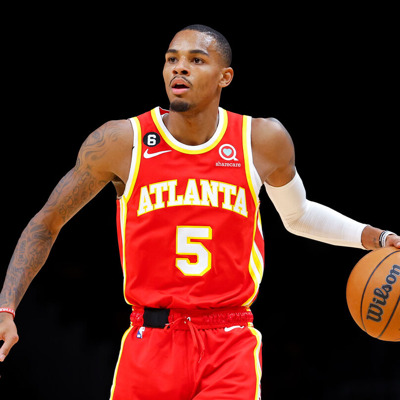 DeJounte in his Hawks uniform dribbling a basketball.