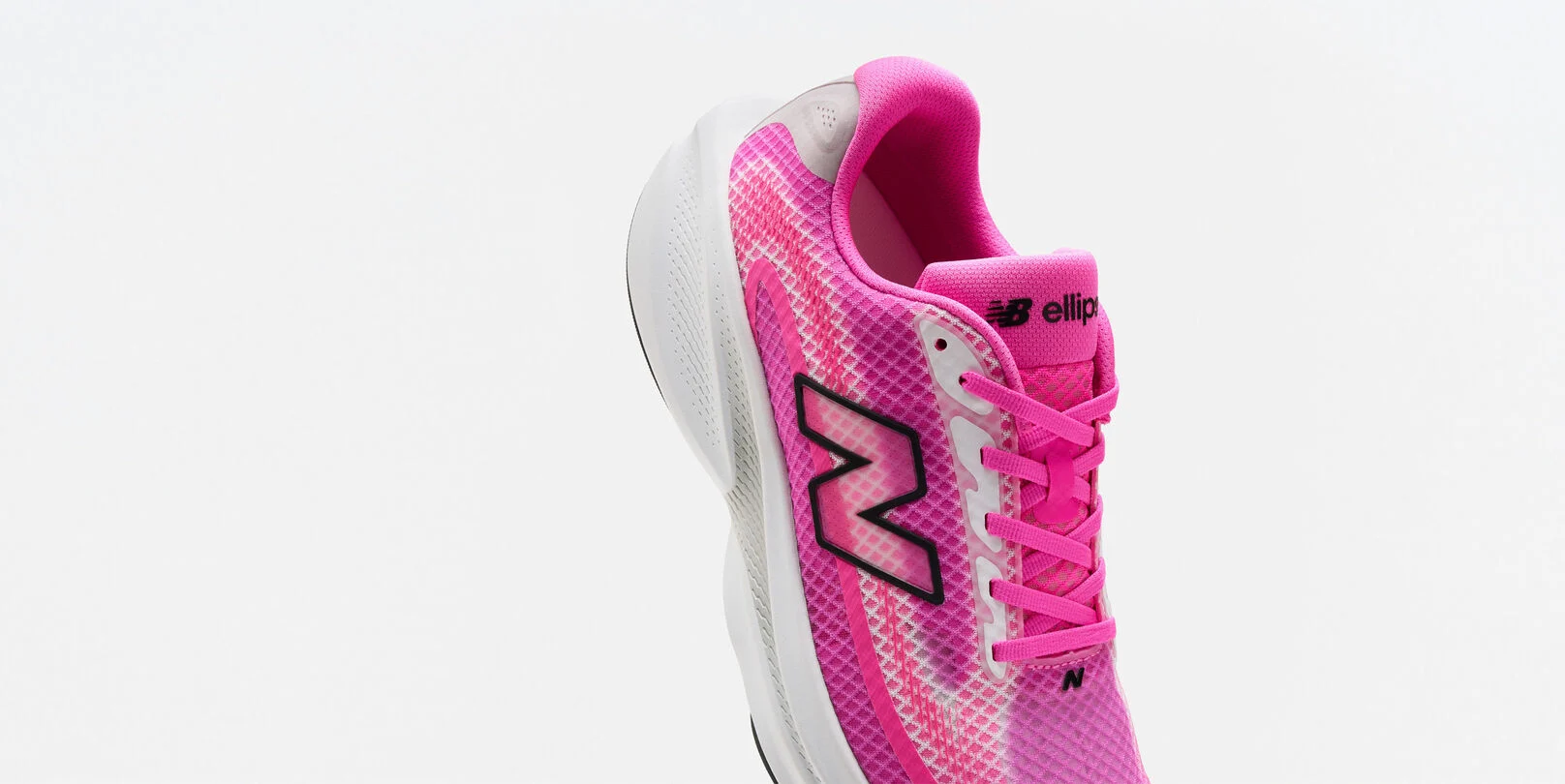 Single pink running shoe on a white background