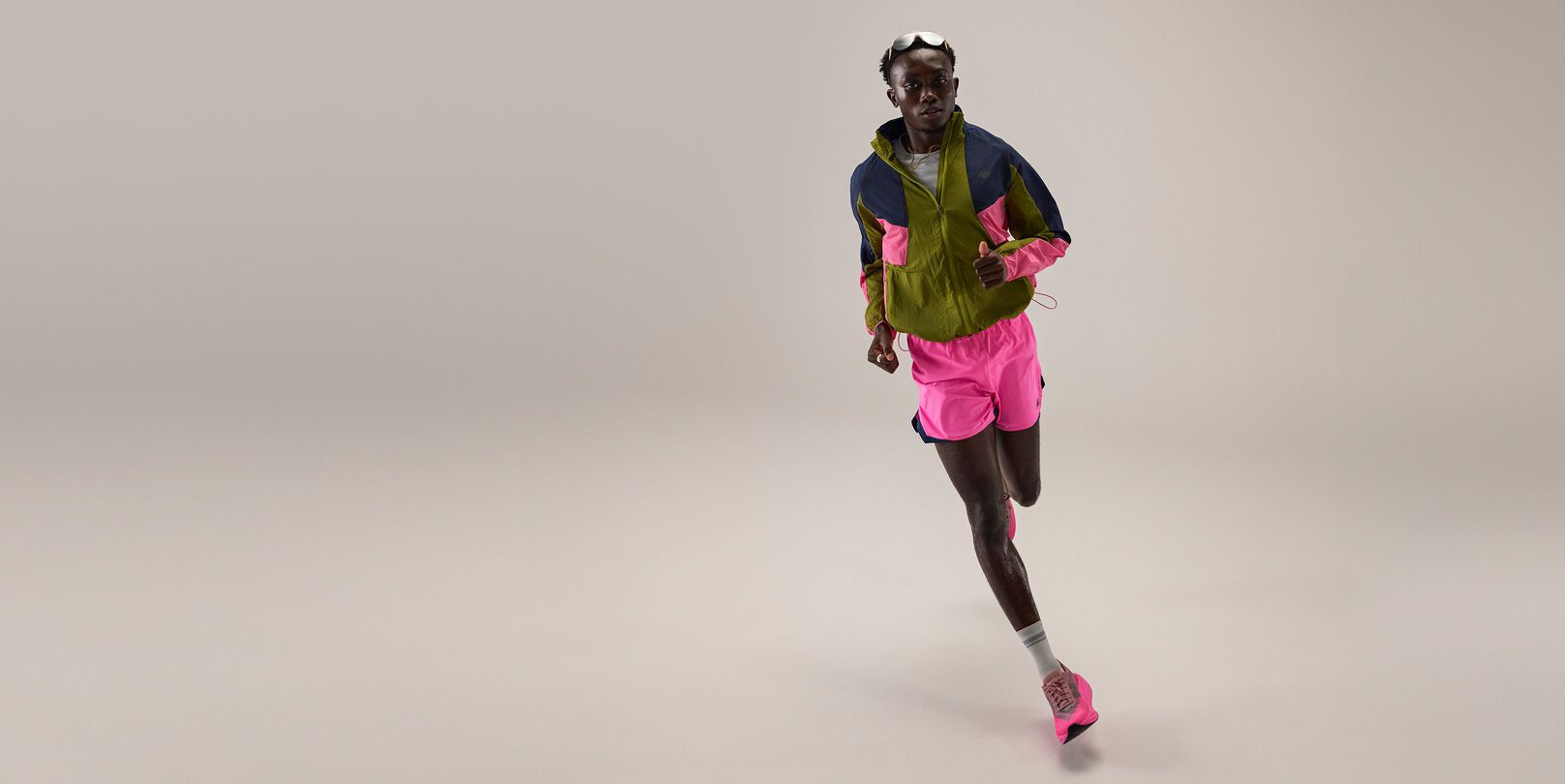 Tinoda Matsatsa running and wearing RC apparel. 