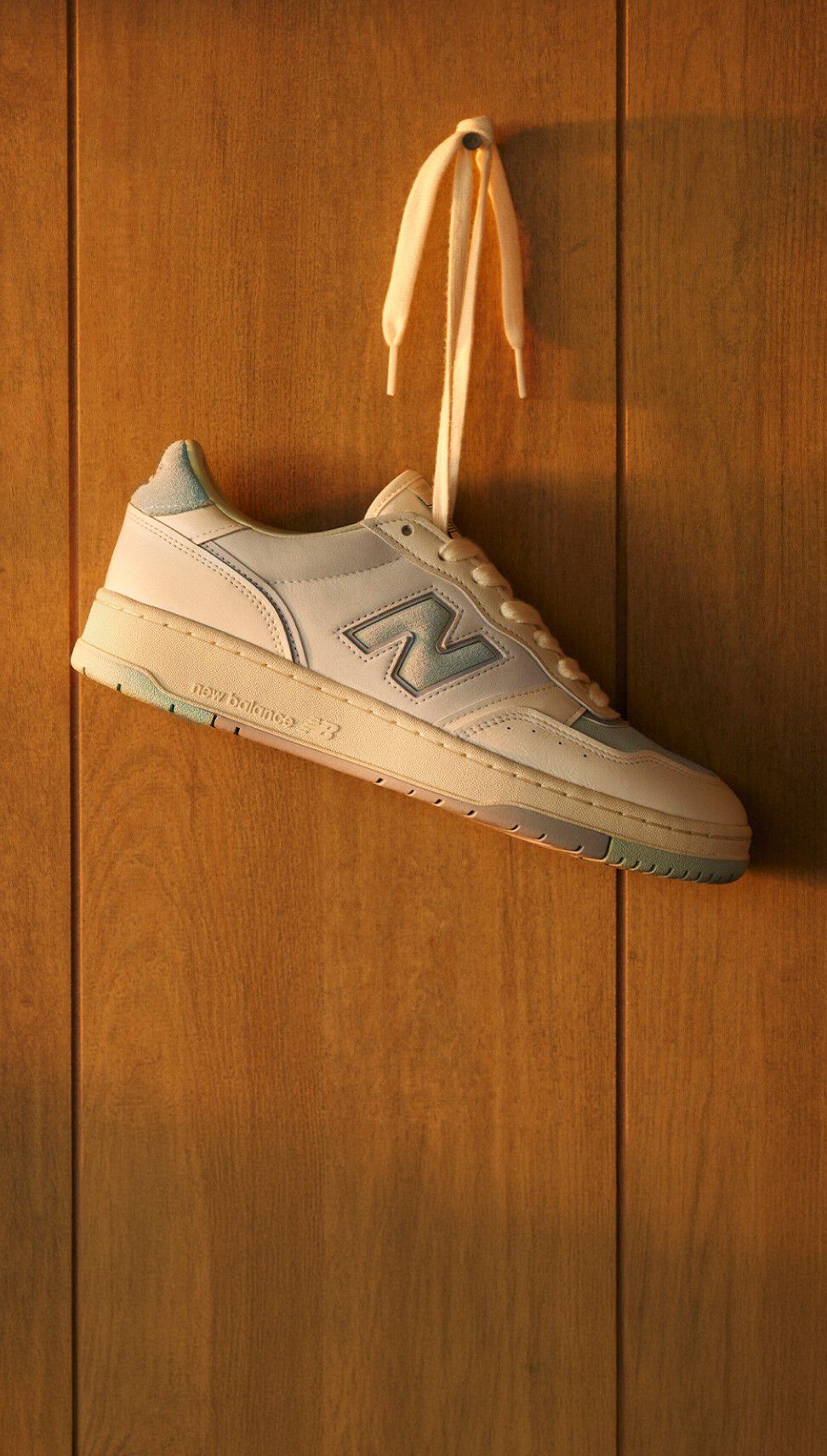 950 shoe hanging by its laces 