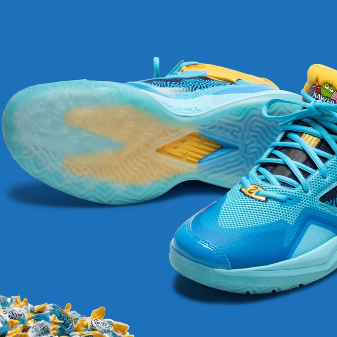 Both shoes on a blue background with one of them showing the outsole.
