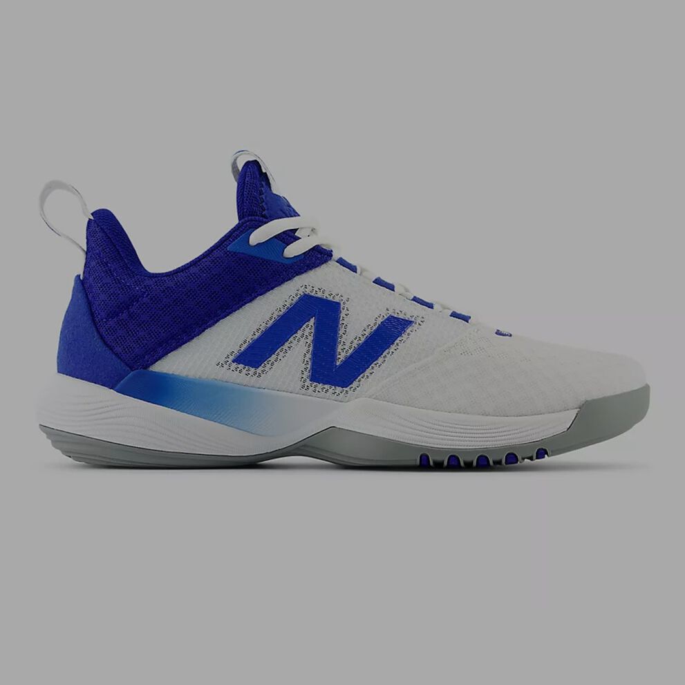 Blue shoe with a blue N logo sitting a grey backbround. 