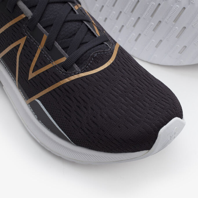 Top down detail show of the mesh upper on the women’s black FuelCell Propel.