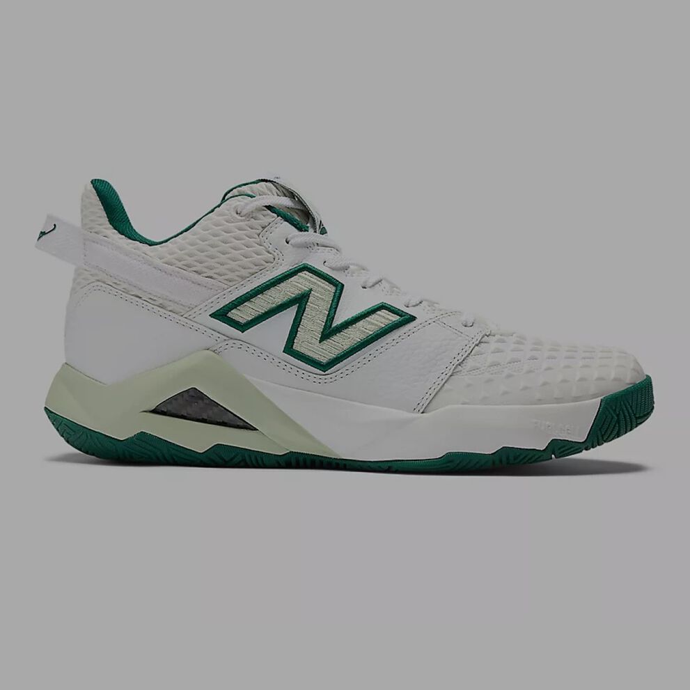 Coco’s signature tennis shoe with green accents. 