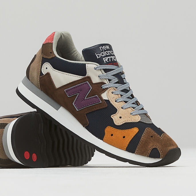 Closeup of a pair of MADE in UK R770 shoes on a grey background