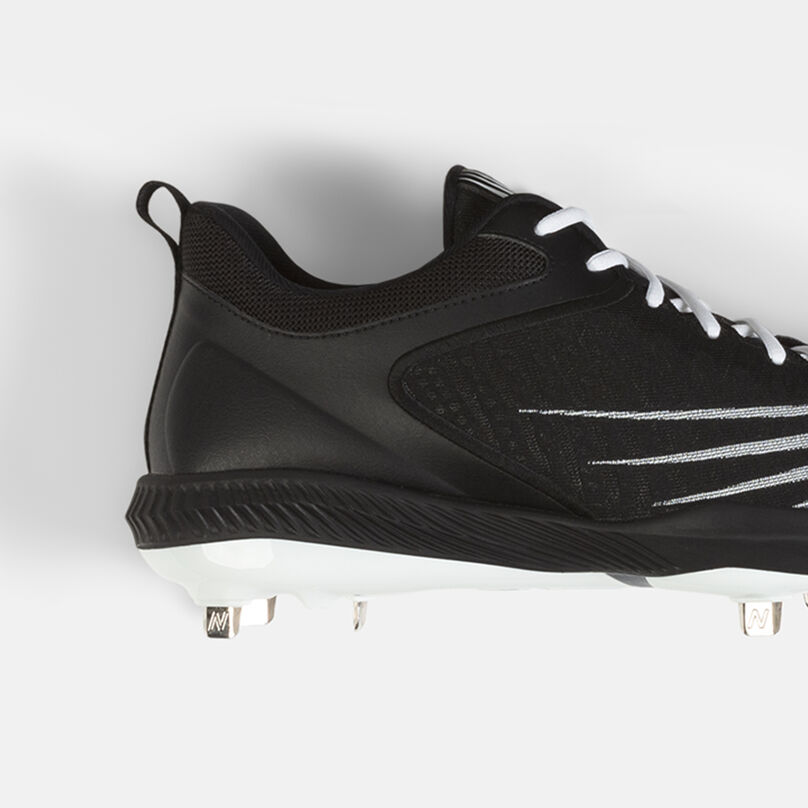 All black metal cleat showing the heel.
