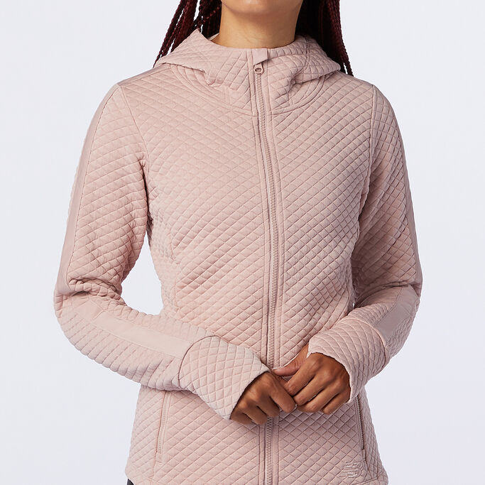 Woman wearing the Heatloft hoodie focusing on the front.