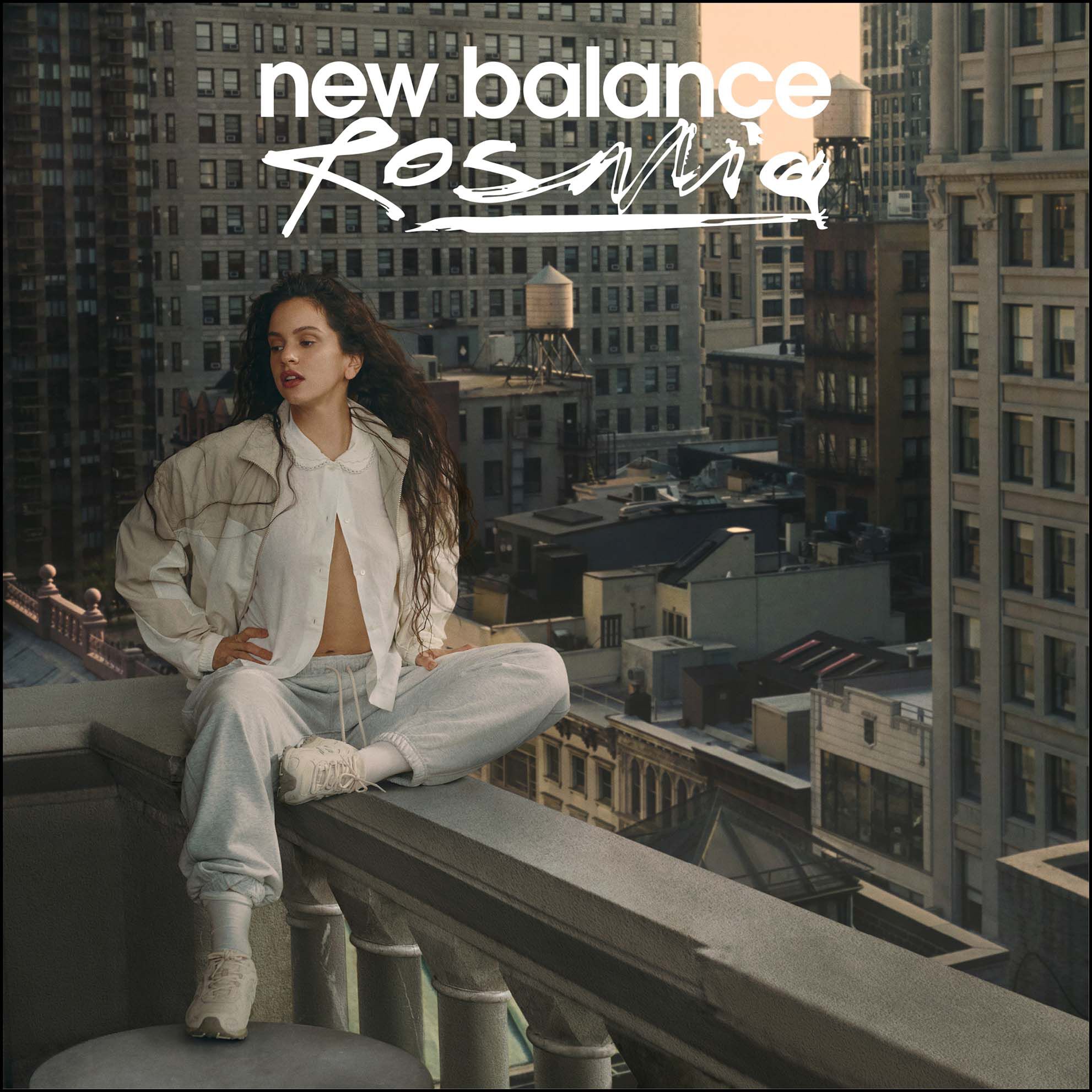 Rosalía sitting on a balcony overlooking the city.