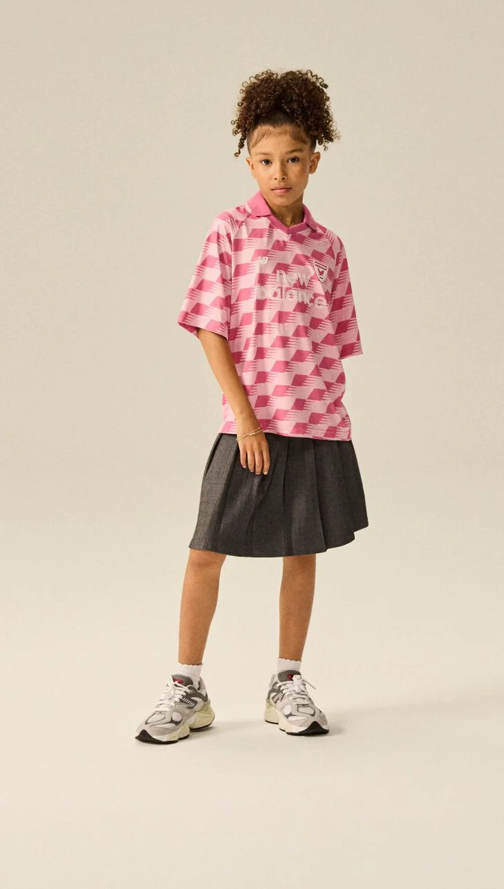 Girl wearing a pair of 9060 shoes.