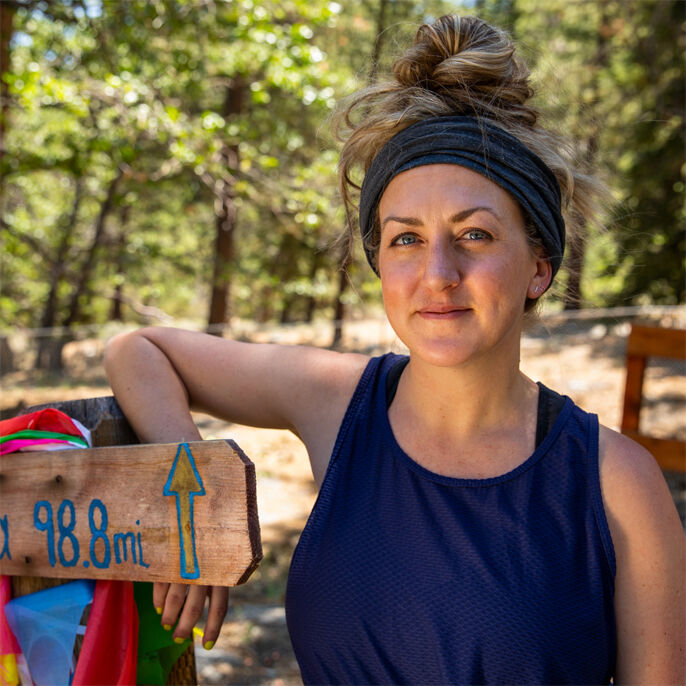 Image of Katie Grossman running in the mountains