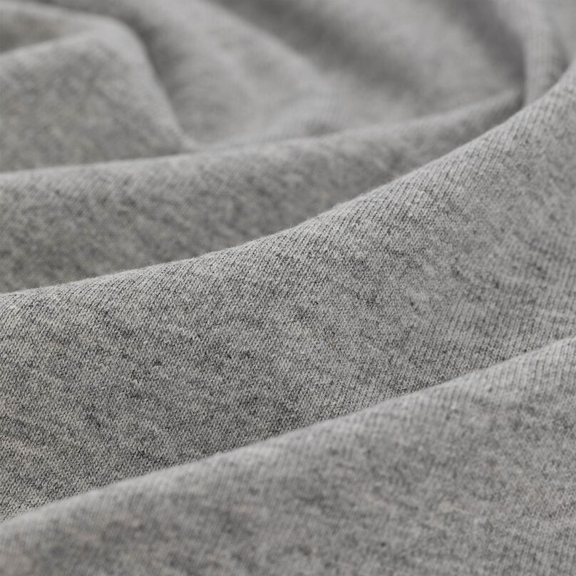 Close up of the texture and material of the short sleeve shirt.