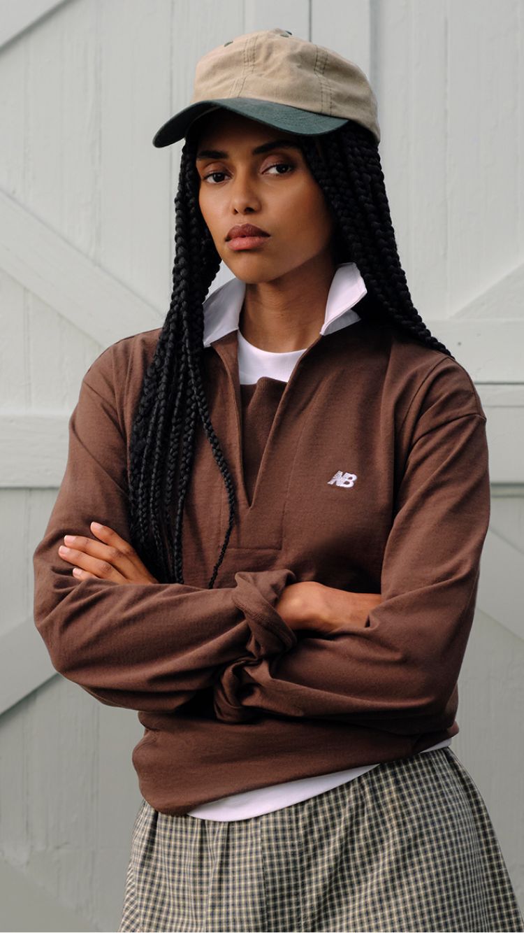 A person wearing Made in USA apparel standing in front of a barn.