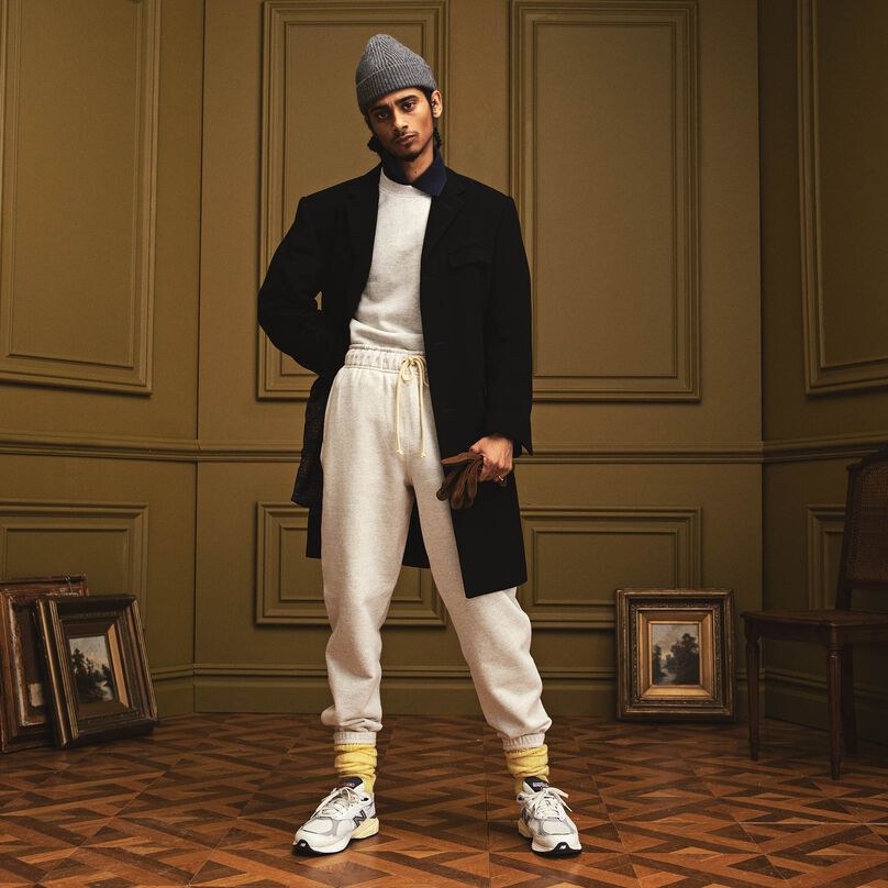 Man standing in a beautiful indoor environment wearing MADE in USA apparel and footwear.
