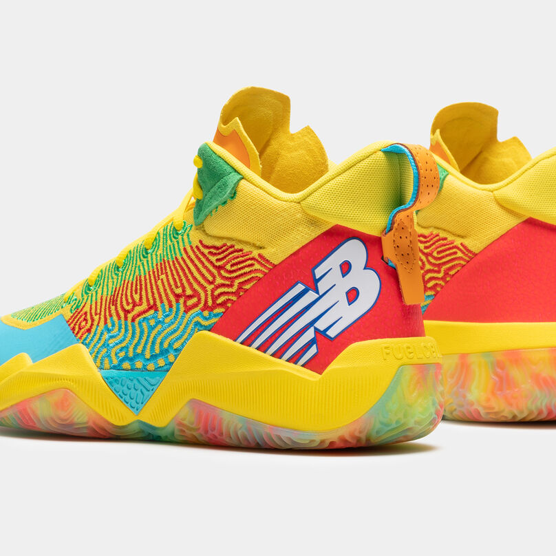 Cropped heel view of a pair of the yellow TWO WXY basketball shoes, with multi colored accents on a light grey background