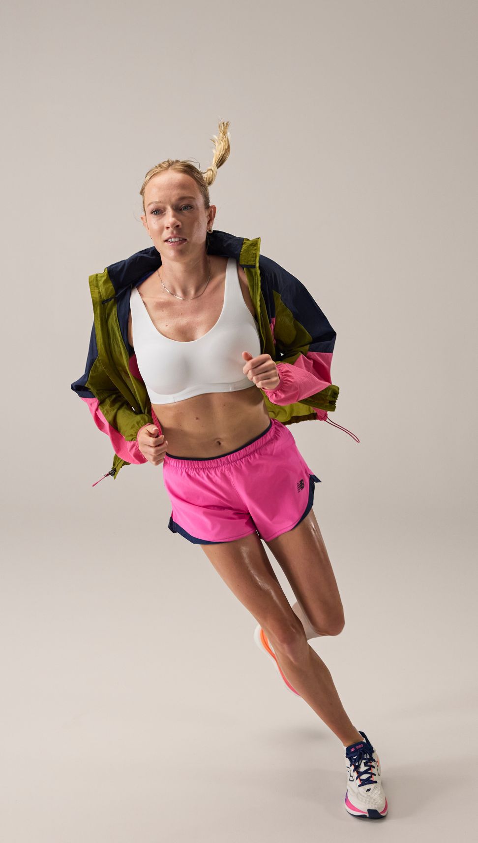 Margot Appleton running and wearing RC apparel. 