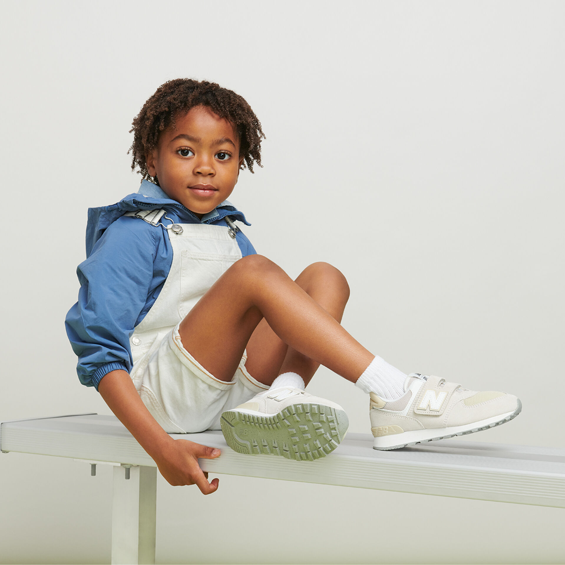 New balance sales kid sneakers