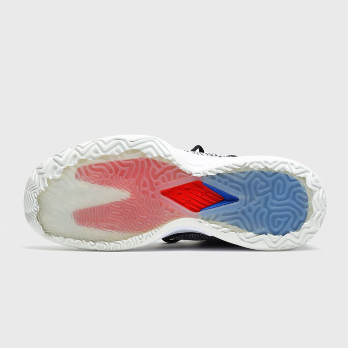 Shoe laying down focusing on the sole.