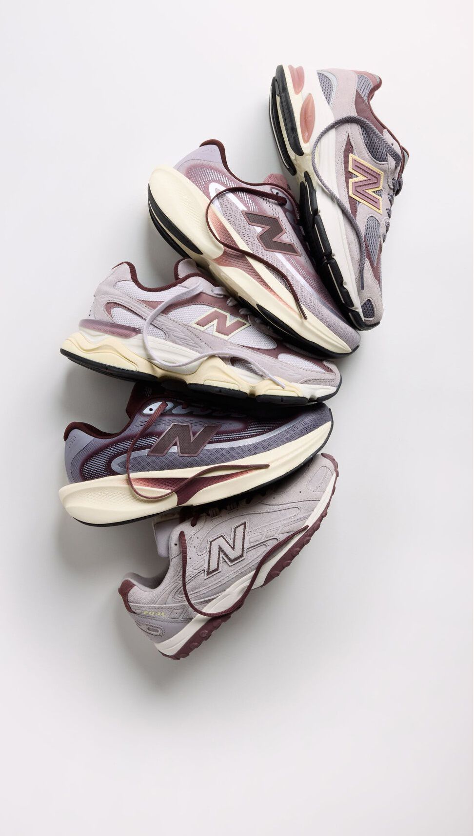 The Crimson Fog Pack sneakers fanned out on a grey background 
