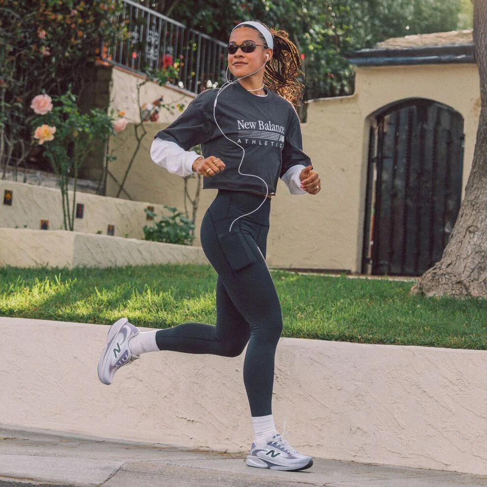 A person running outside wearing Ellipse shoes. 