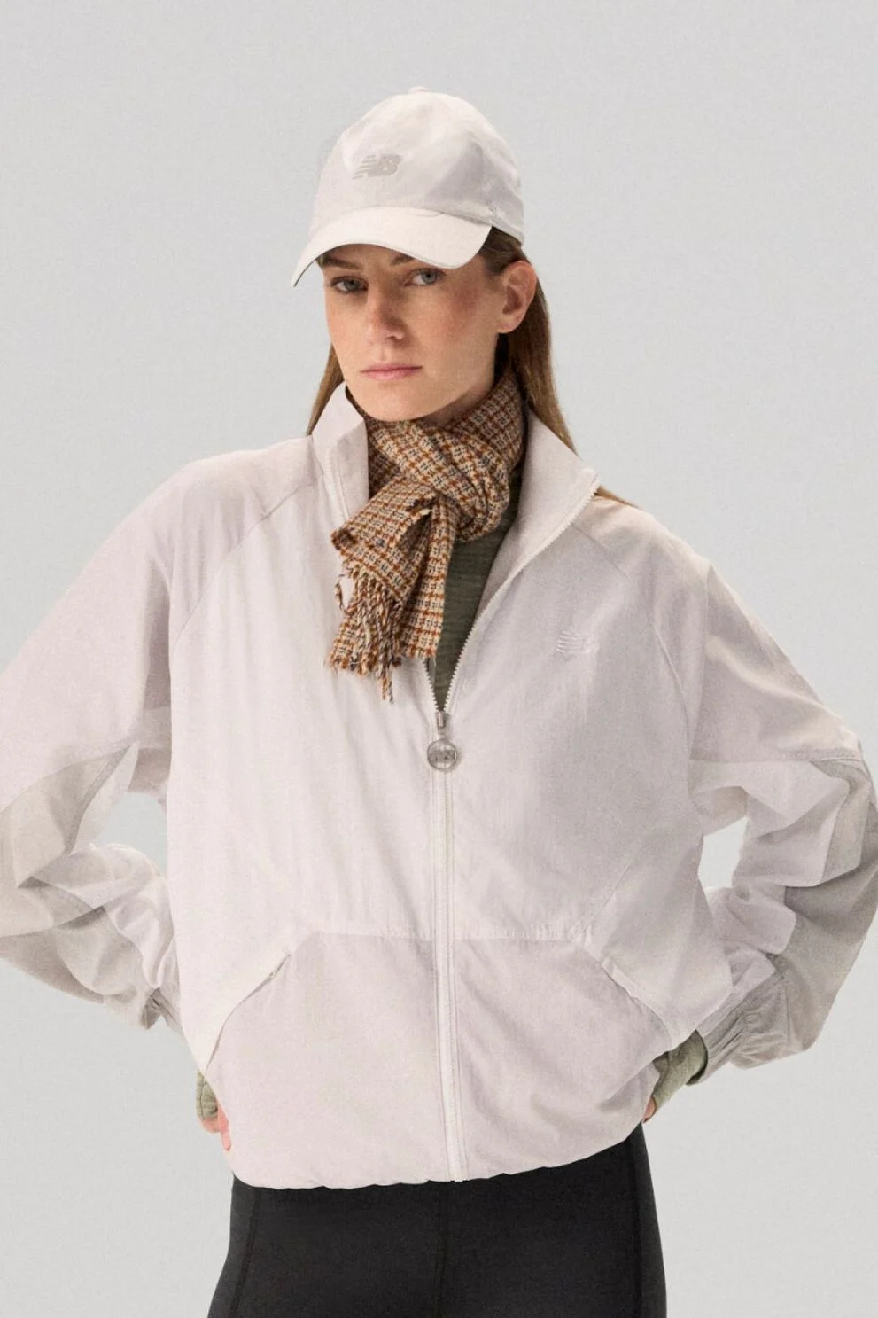 Young lady wearing NB clothing and '47 brand hat.