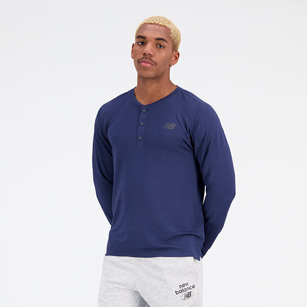 Man wearing a dark-blue NB Henley shirt and light-grey NB sweatpants
