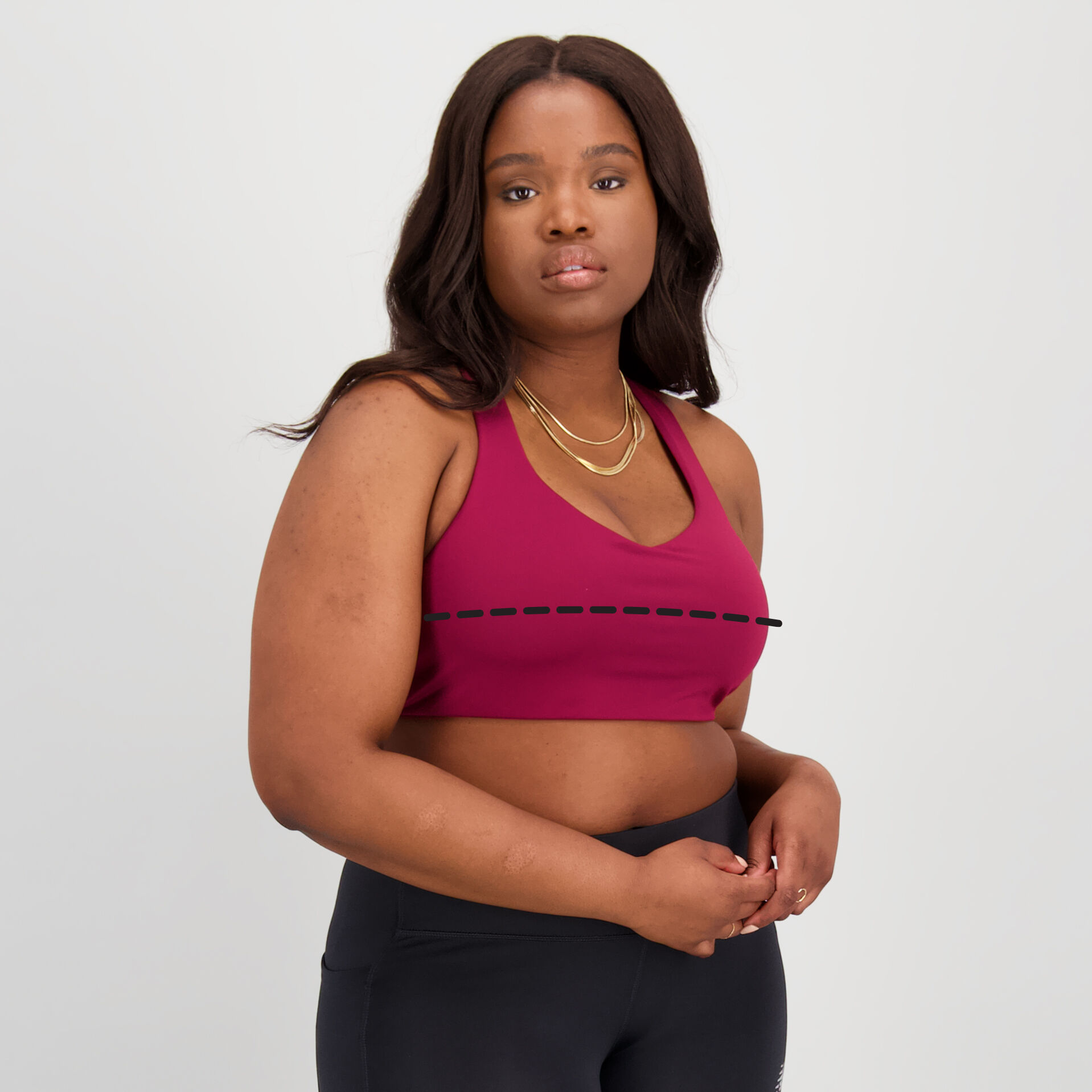 Woman wearing a maroon NB Power X Bra
