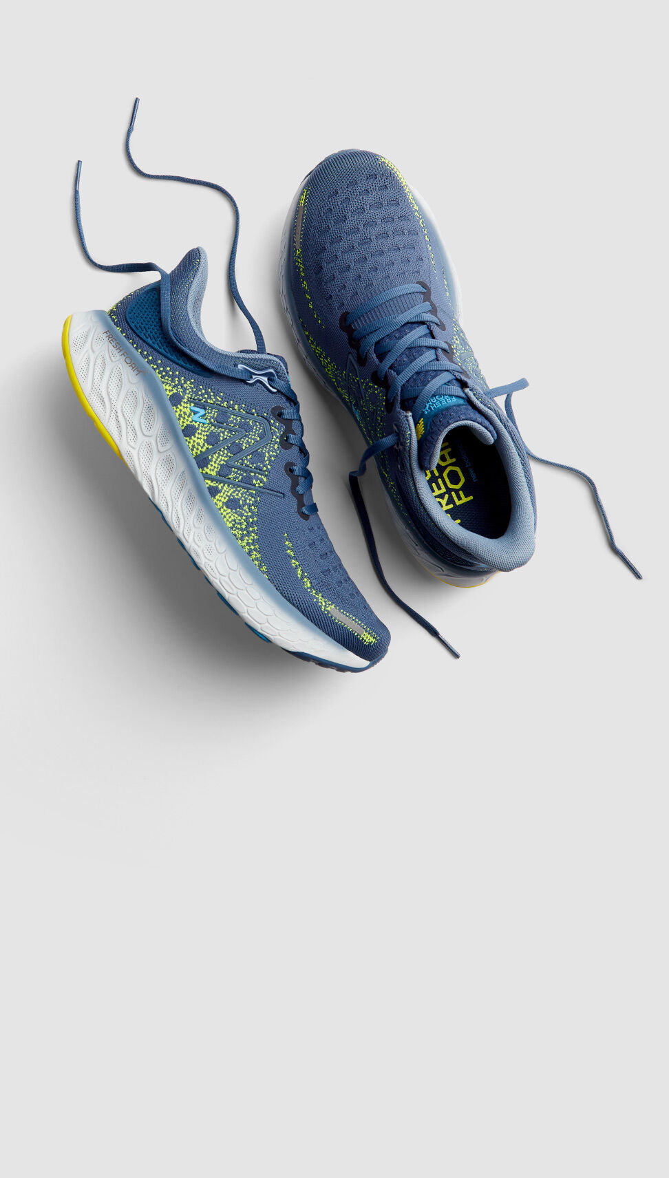 Pair of blue 1080v12 shoes in studio.