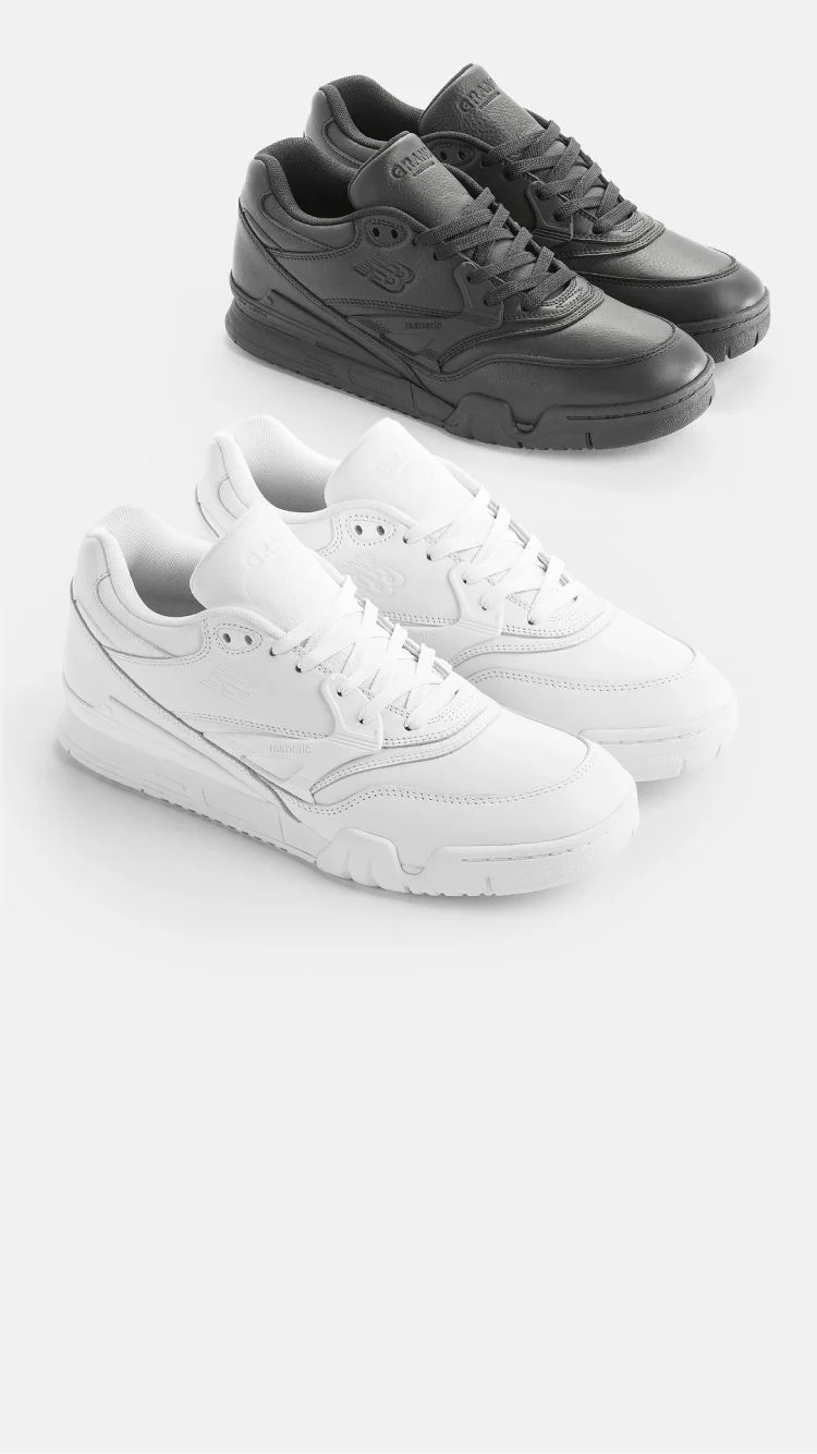 One pair of white 770 shoes and one pair of black 770 shoes in studio.