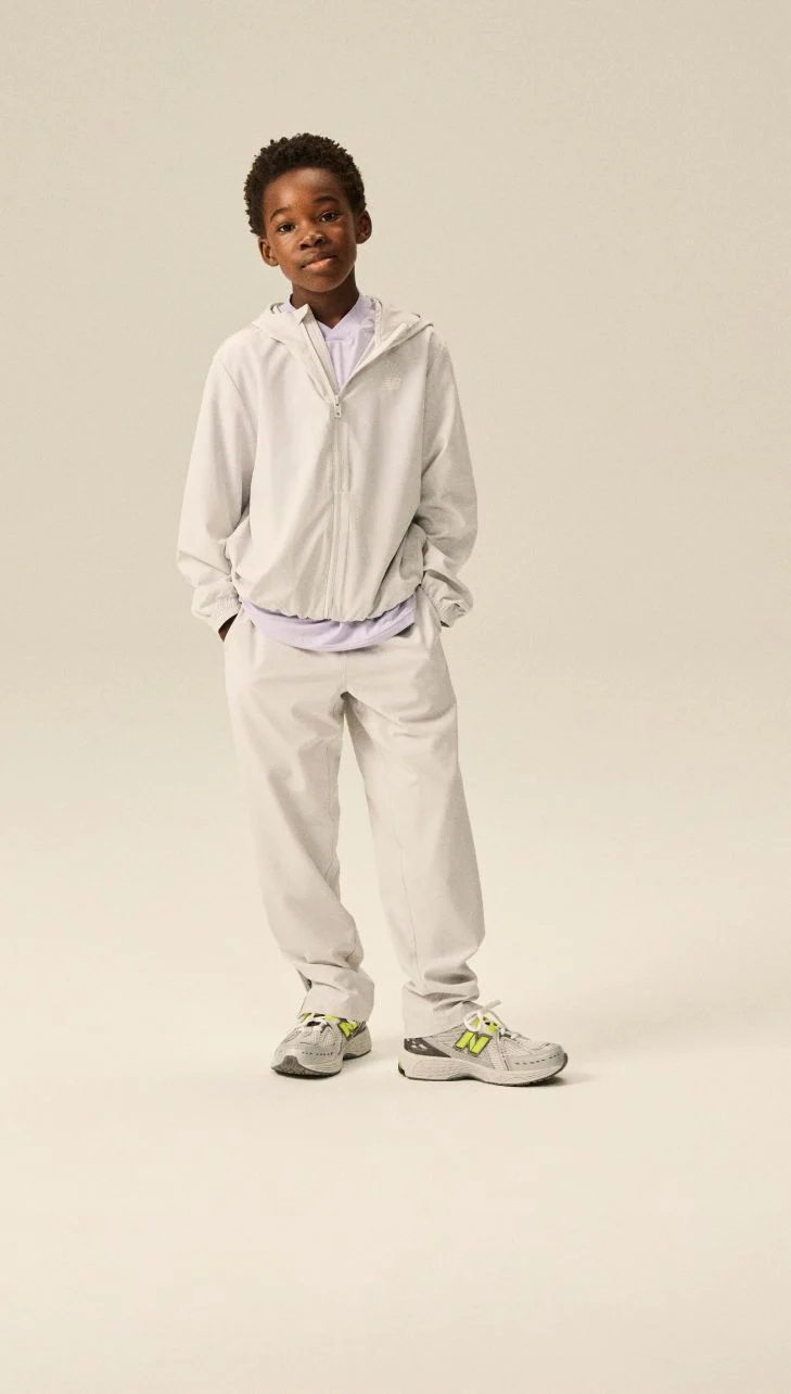 Boy wearing a pair of 1906 shoes.