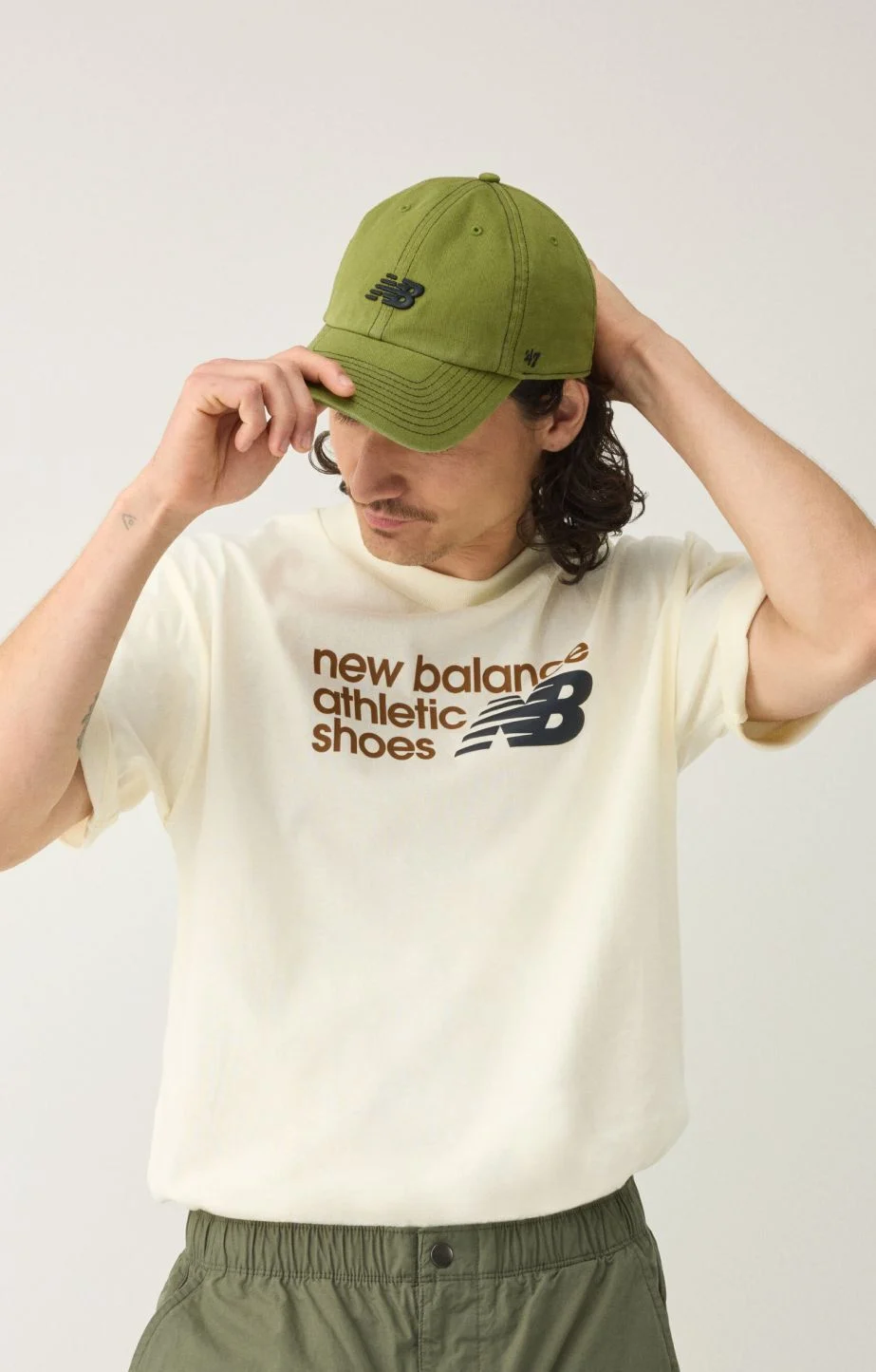 A man wearing a green hat. 