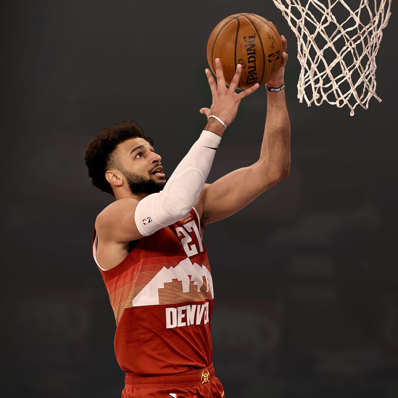 Jamal Murray going in for a dunk.