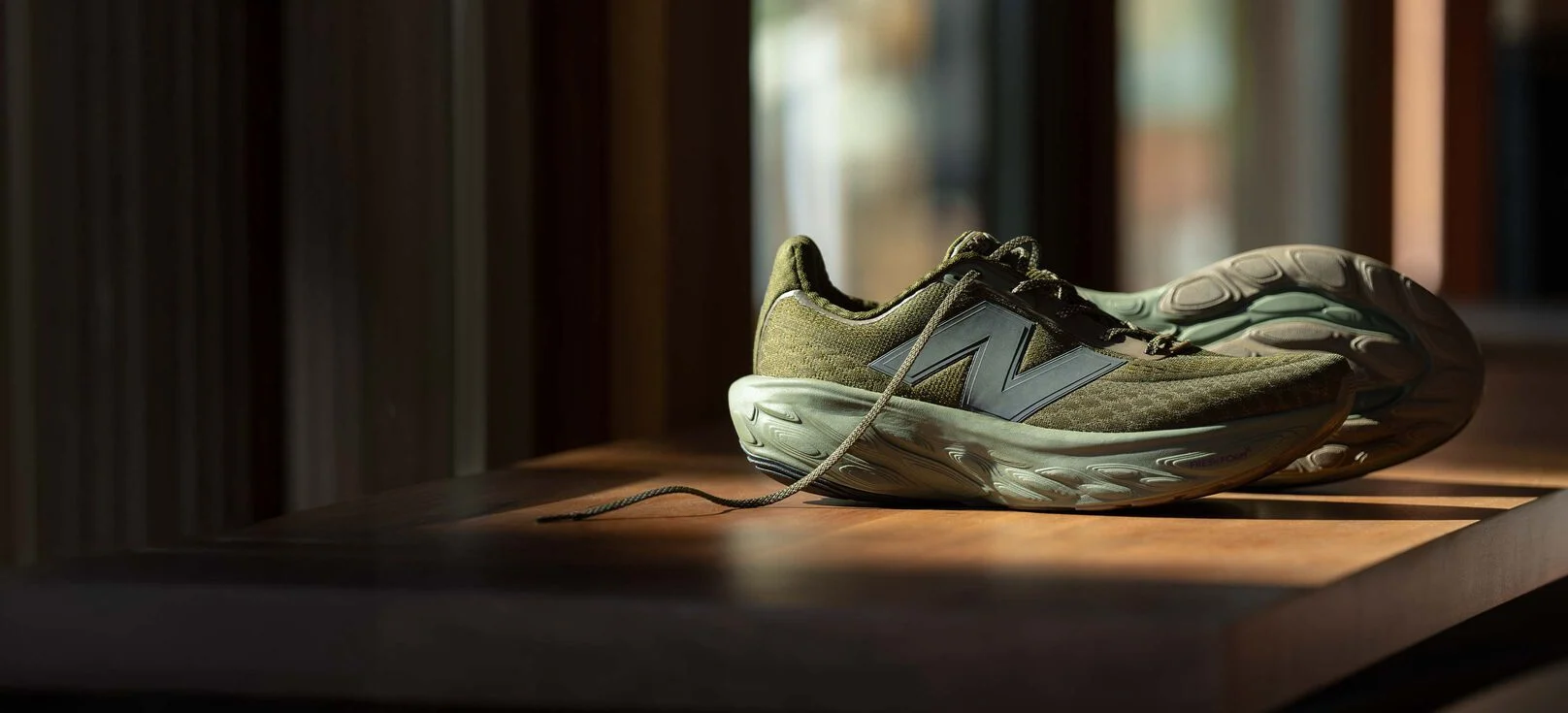 A pair of green 1080v14 shoes.