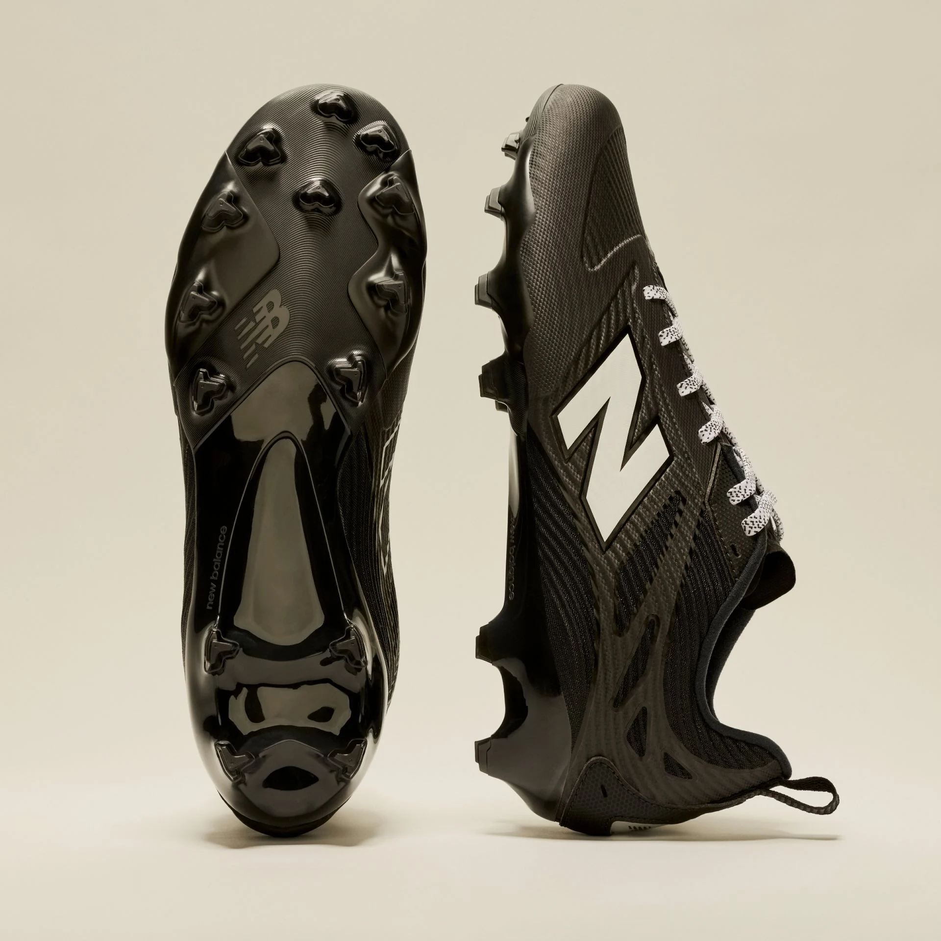 A pair of black Rev iQ shoes in studio.