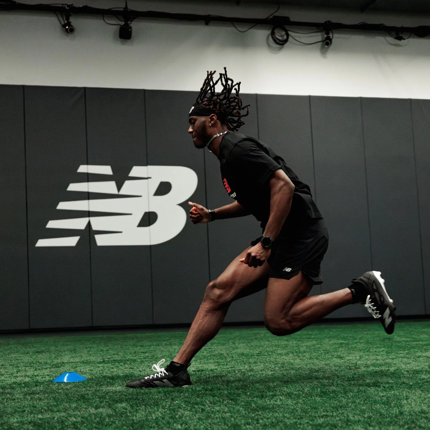 Marvin Harrison Jr running on turf.