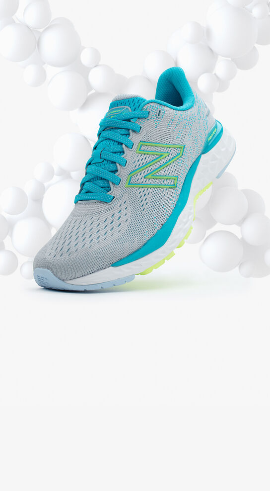 Grey and light blue running shoe floating in front of the letter X made out of small white bubbles.