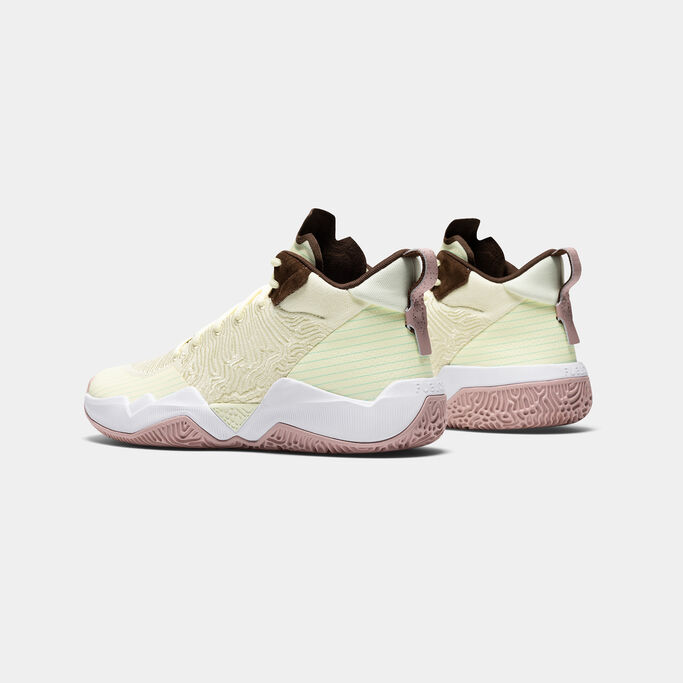 Pair of the cream shoes focusing on the heel.