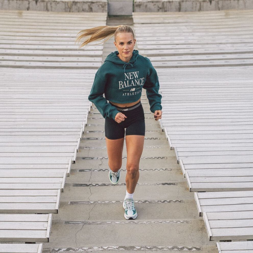 Parker Valby running up bleacher stairs