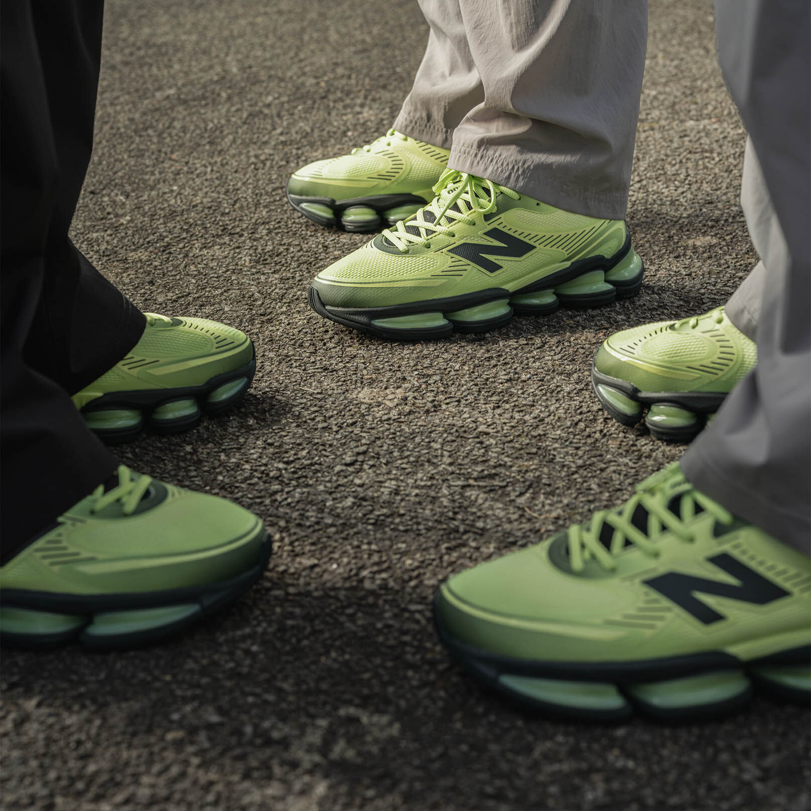 On-figure shot of the lime green shoes worn by three different people.