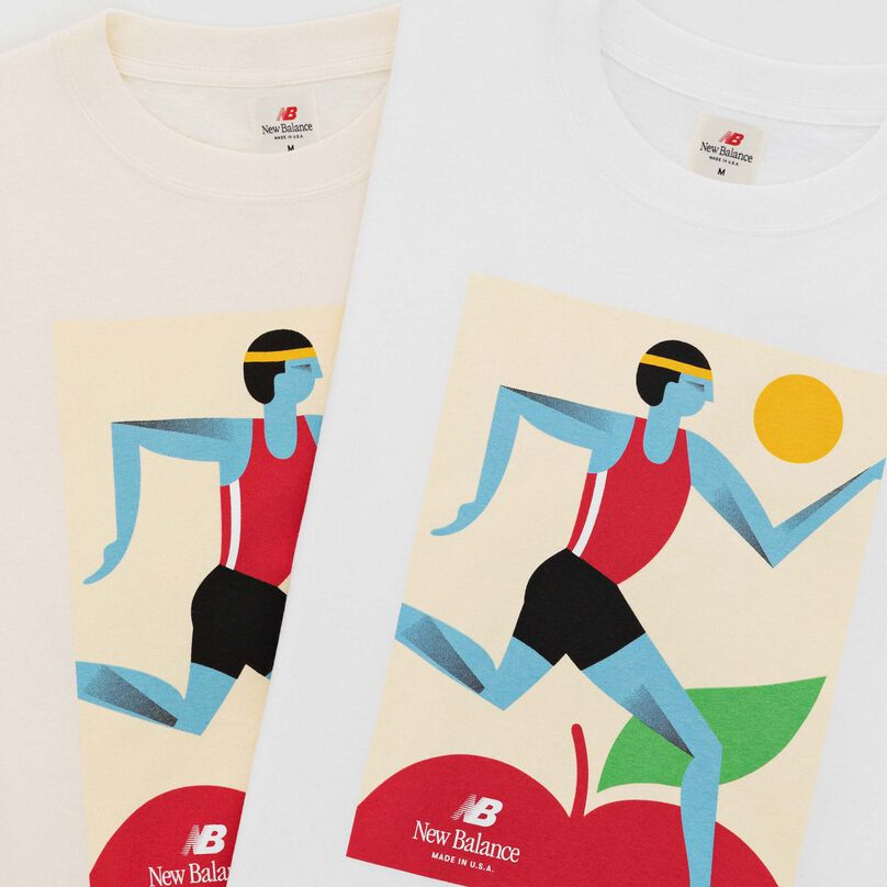 White and cream MADE in USA Marathon sleeve shirts laid on top of each other.