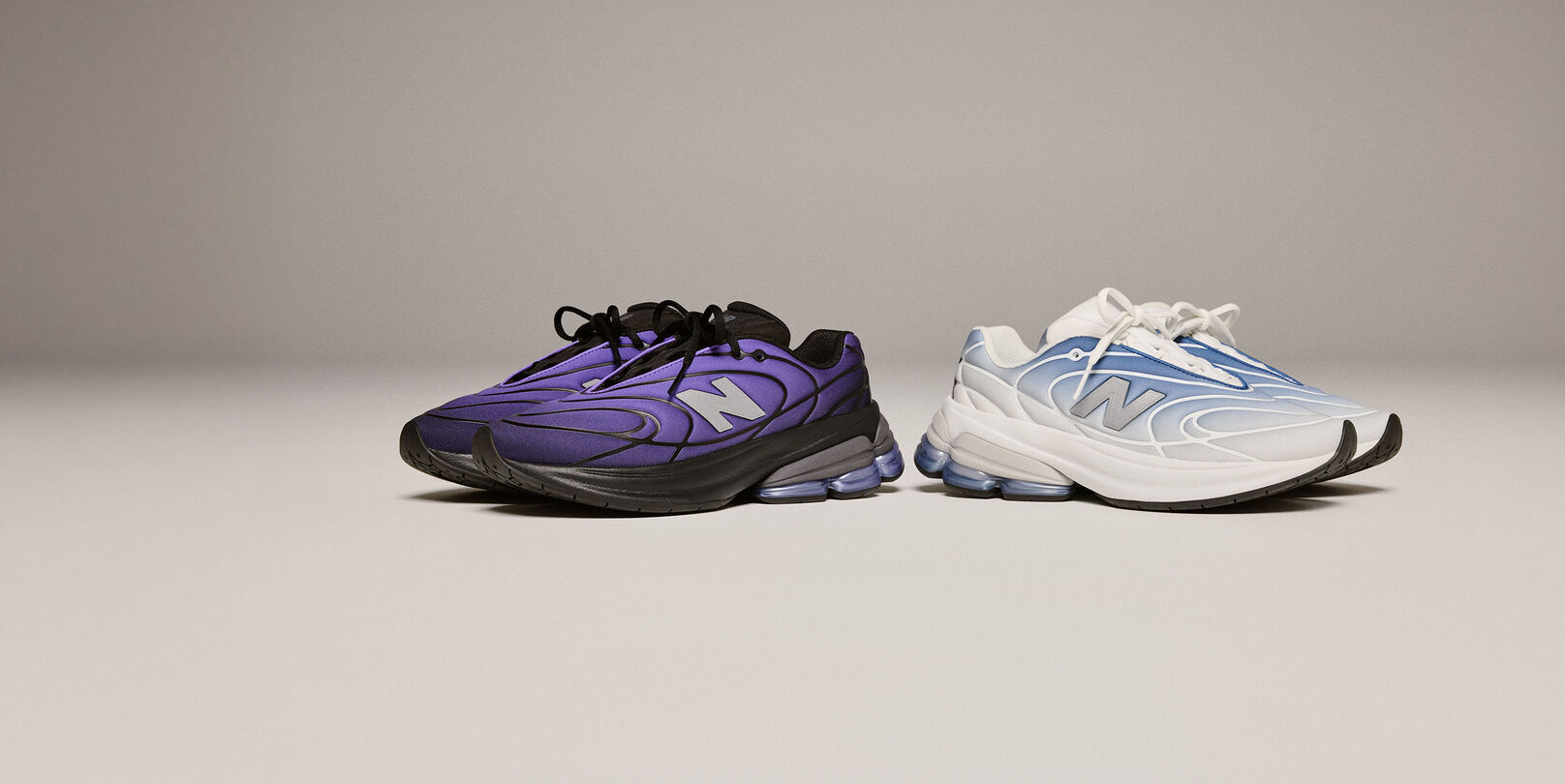 Two pairs of shoes, light blue and dark purple, on a beige background.