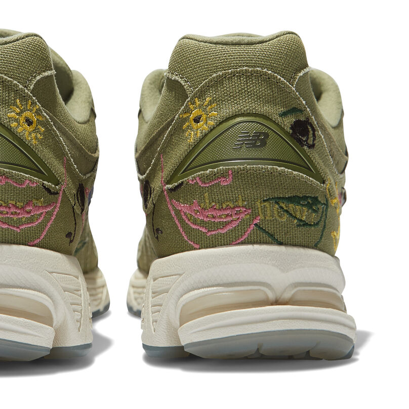 View of the back of two olive green 2002R shoes