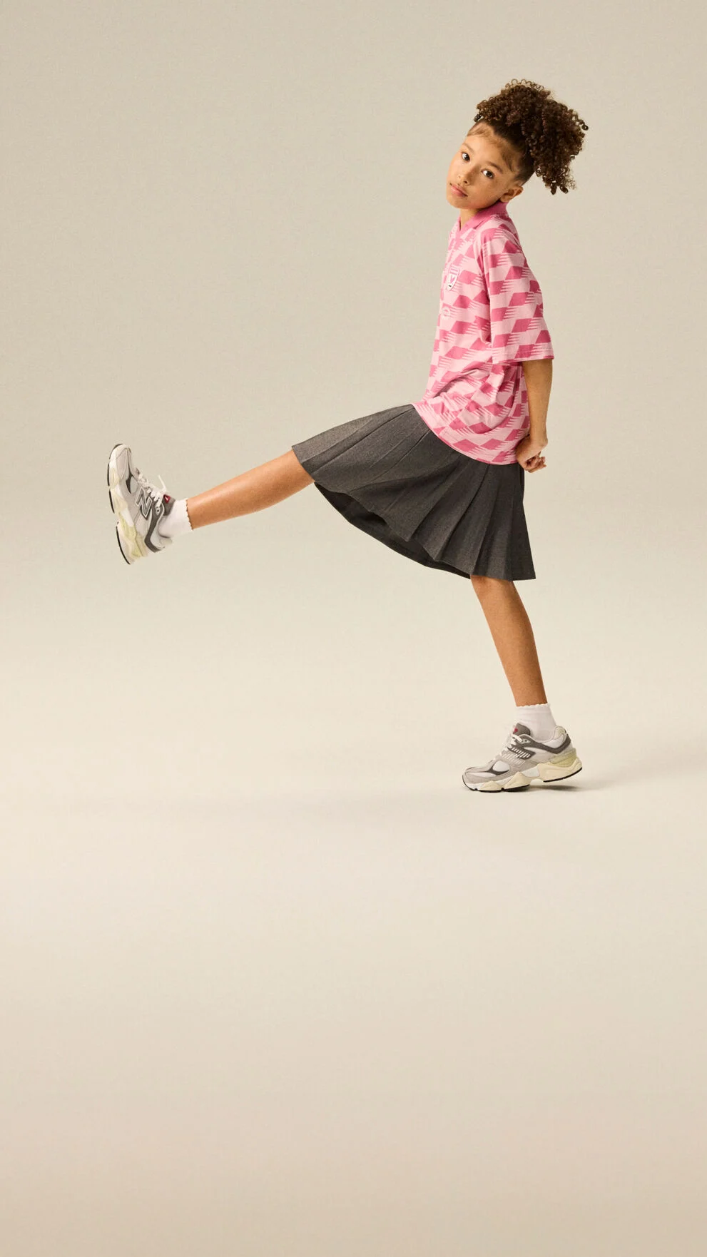 Girl wearing a pair of 9060 shoes.