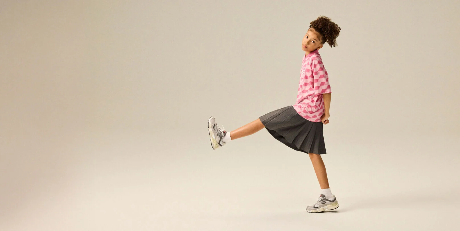 Girl wearing a pair of 9060 shoes.