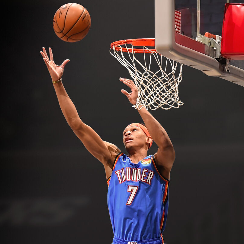 The intern grabbing a rebound above the rim.