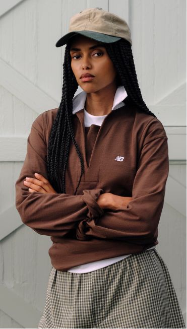 A person wearing Made in USA apparel standing in front of a barn.